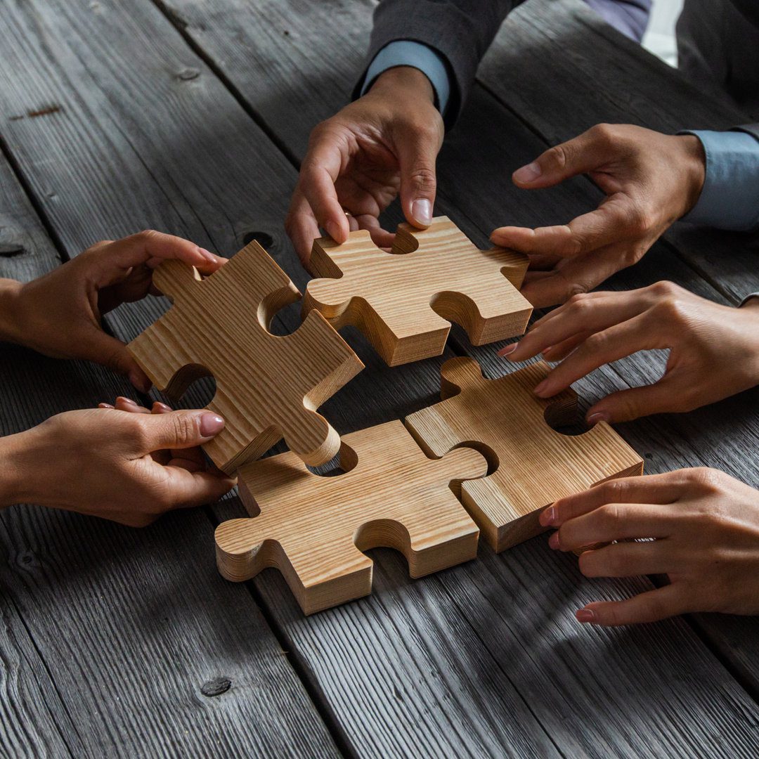 Business people and puzzle pieces
